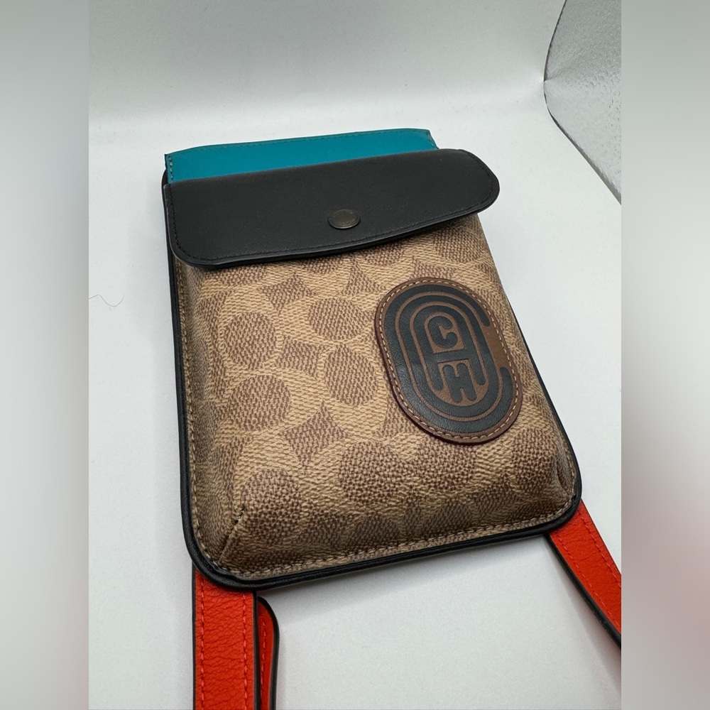 Coach Hybrid Pouch With Signature Canvas Blocking And Coach Patch